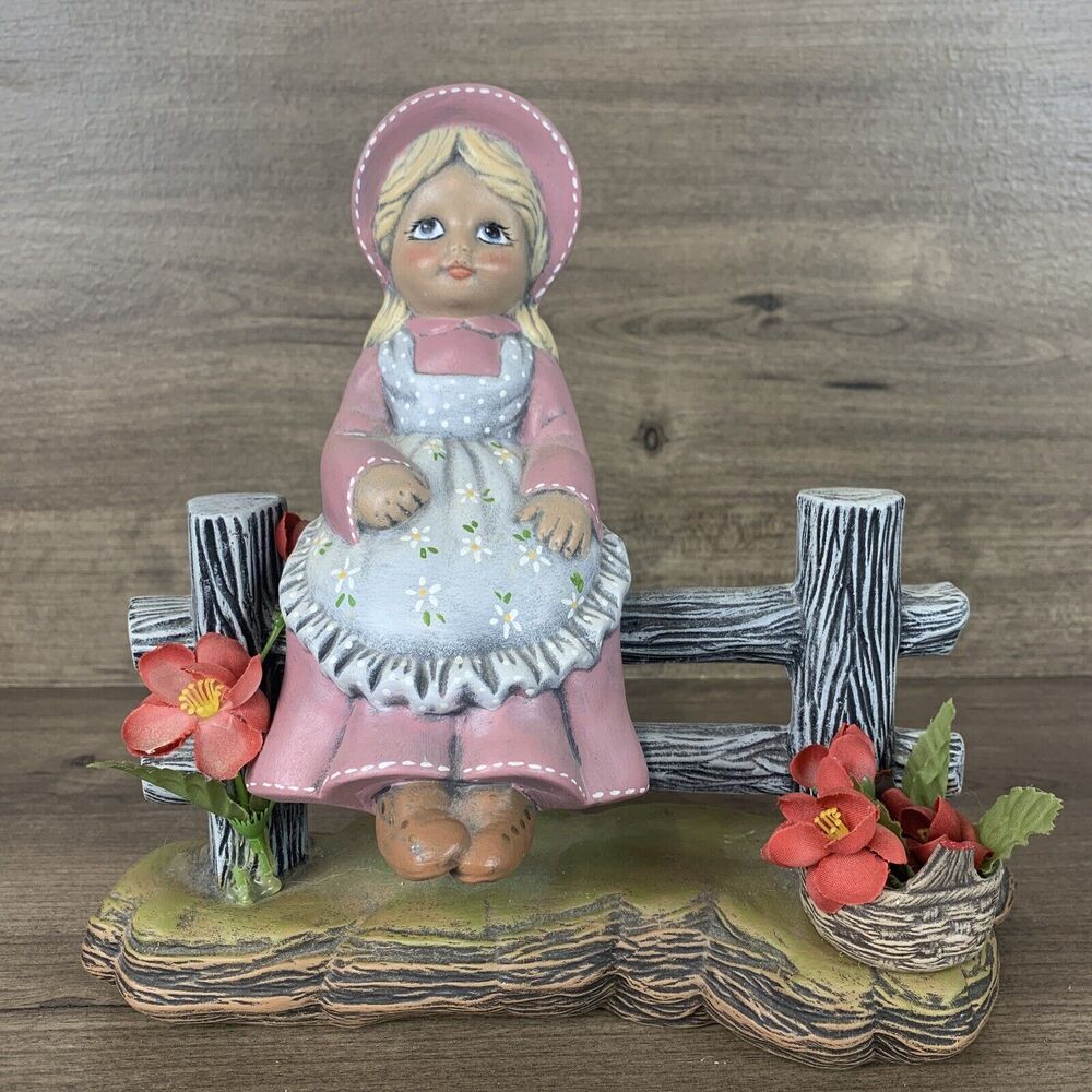 Figurine Just Resting Blonde Girl on Fence with Basket Flower Ceramic Home Decor
